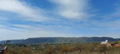 a view of a city with mountains in the background at Complejo SARA HOUSE in Santa Rosa de Calamuchita