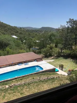 a swimming pool with a view of a mountain at Just Rest in Villa Serranita