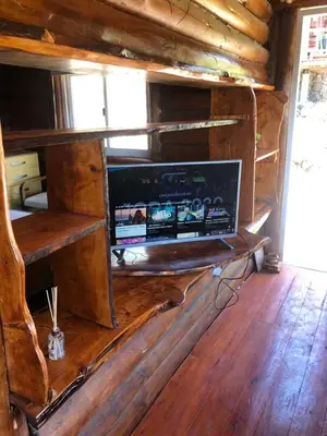 a room with a computer in a wooden cabin at Just Rest in Villa Serranita