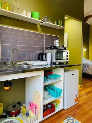 a kitchen with a sink and a counter top at Cabañas Namaskar in Villa Serranita