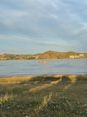 a group of people kayaking on a body of water at Cabañas Sueño Dorado in Potrero de Garay
