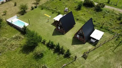 an overhead view of a small house with a pool at Cabañas Sueño Dorado in Potrero de Garay