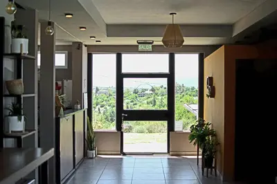 a hallway with an open door with a view at Alamo Hotel in Villa Carlos Paz