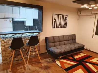 a living room with a couch and two chairs at Alojamiento Maria :-) in Cordoba