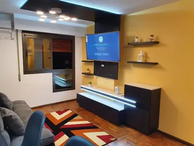 a living room with a couch and a tv at Alojamiento Maria :-) in Cordoba