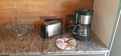 a counter with a toaster and a blender on it at Alto Hermoso Apart in Cordoba