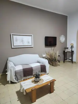 a living room with a couch and a coffee table at Rivahome in Cordoba
