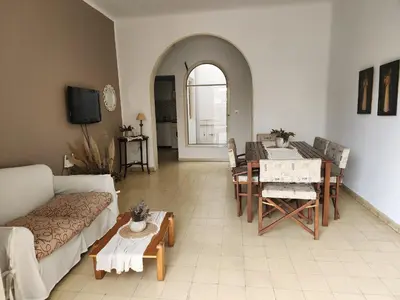 a living room with a couch and a table at Rivahome in Cordoba