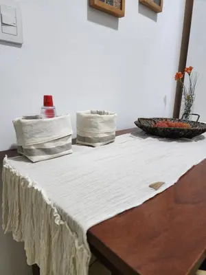 a table with a white table cloth and a bowl on it at Rivahome in Cordoba