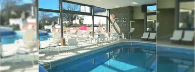 two pictures of a swimming pool in a house at Florida Hotel & Spa in Villa Carlos Paz