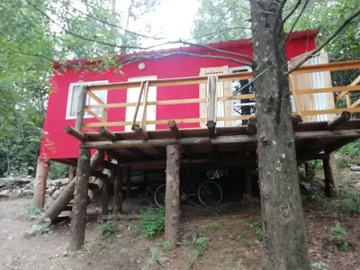 a tree house on stilts in the woods at Las Zarinas 3 in Trapiche
