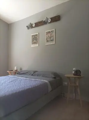 a bedroom with a bed and two side tables at Torito's House 3 in Tanti