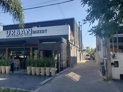 a restaurant with plants in front of a building at Amplio Dpto s/Av Rafael Nuñez - cerro de las rosas in Cordoba