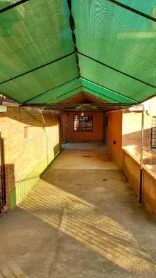 an empty parking garage with a green roof at Casas villa suiza con terraza in Villa Carlos Paz