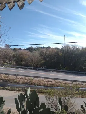 a road with a street light on the side of the road at Cabaña 