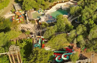 an aerial view of a water park with a roller coaster at Pequeña Polonia-Lodge & Cabañas in Los Reartes