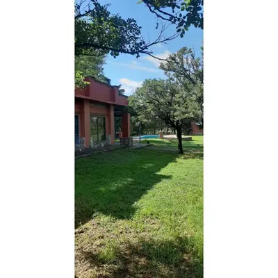 a house with a tree in the yard at Casona de campo in Santa María