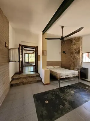 a bedroom with a bed and a ceiling fan at Casona de campo in Santa María