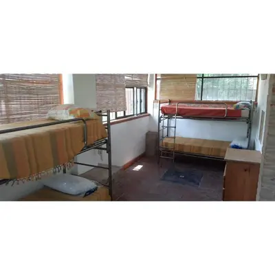 a room with two bunk beds and a window at Casona de campo in Santa María