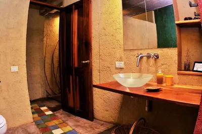 a bathroom with a sink and a mirror at Cuatrovientos Hostería in San Javier