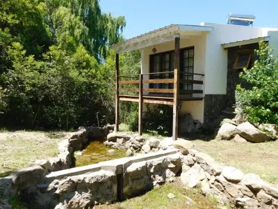 a house with a staircase in front of it at 7 esencias in Villa Yacanto