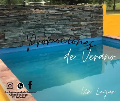 an image of a swimming pool with the words architecture be veriors at Cabañas UN LUGAR in Villa General Belgrano