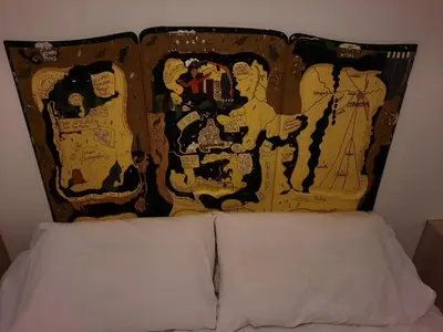 a bed with two pillows on top of it at Departamento Centro Artístico Manzana Jesuítica in Cordoba