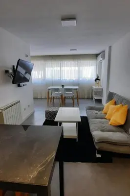 a living room with a couch and a table at Departamento Centro Artístico Manzana Jesuítica in Cordoba