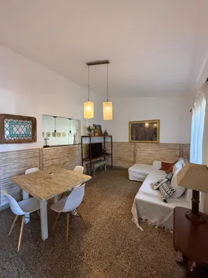 a living room with a table and a couch at Elportal in Alta Gracia
