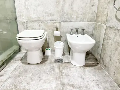 a bathroom with a toilet and a sink at Constantino V in Villa Carlos Paz