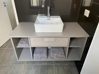 a bathroom with a sink and a counter with towels at ALEM LANE in Villa Carlos Paz