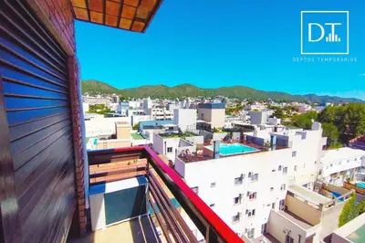 a view of a city from the balcony of a building at Depto Las Heras in Villa Carlos Paz