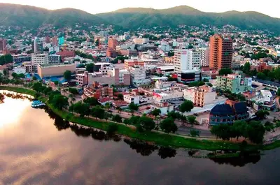 an aerial view of a city next to a body of water at Depto Las Heras in Villa Carlos Paz