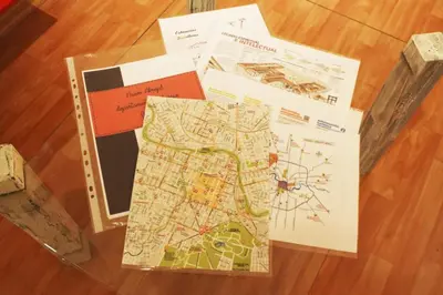 a group of maps and cards on a table at Nuevo Abrojal: departamento en Barrio Güemes in Cordoba