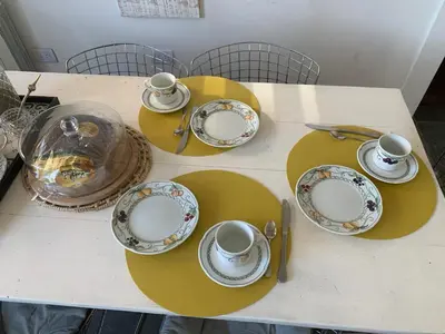 a table with cups and saucers on it at Mirador de Plaza España in Cordoba