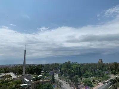 a view of a city with a clock tower and a street at Mirador de Plaza España in Cordoba