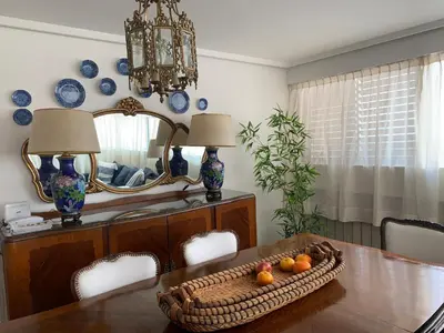 a dining room table with a mirror and a basket of fruit at Mirador de Plaza España in Cordoba
