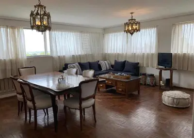 a living room with a table and a couch at Mirador de Plaza España in Cordoba