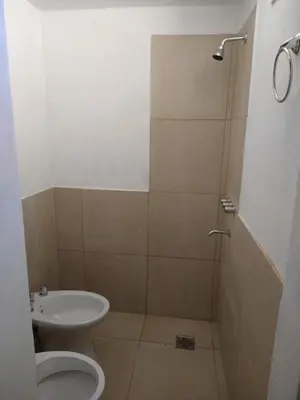 a bathroom with a shower with a toilet and a sink at El diquecito duplex in Casa Bamba
