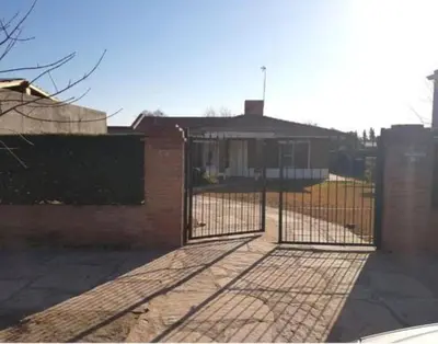 a gate in front of a house at Casa Anémona in Merlo