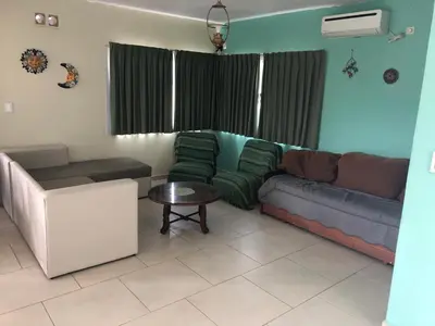 a living room with a couch and a table at Casa Miradores del Lago in Bialet Massé