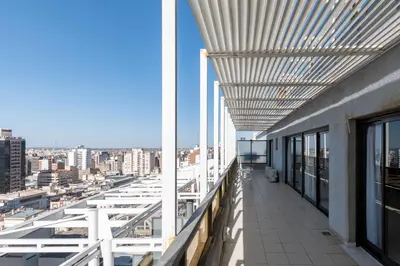 a balcony of a building with a view of a city at AT Suites in Cordoba