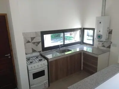 a small kitchen with a stove and a sink at Casa EBEL in Alpa Corral