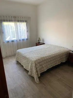 a bedroom with a bed and a window at Casa EBEL in Alpa Corral