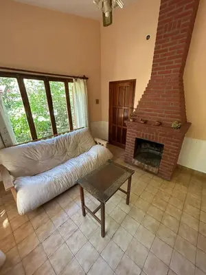a living room with a couch and a fireplace at La Luisa in Merlo