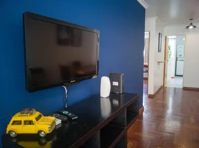 a living room with a tv and a toy car on a table at Laprida y Trejo Apartamento in Cordoba