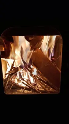 a fire is burning in a brick oven at I Víla in Villa Carlos Paz