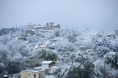 a city covered in snow with houses and trees at I Víla in Villa Carlos Paz