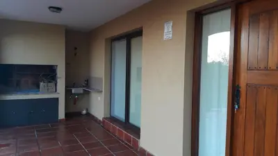 an empty room with a door and a tile floor at ASM CASA III in Merlo