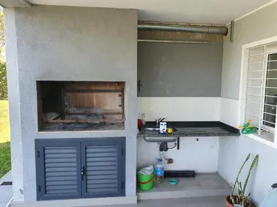 a garage with a sink and a sink at Balcones del Lago in Villa Parque Siquiman